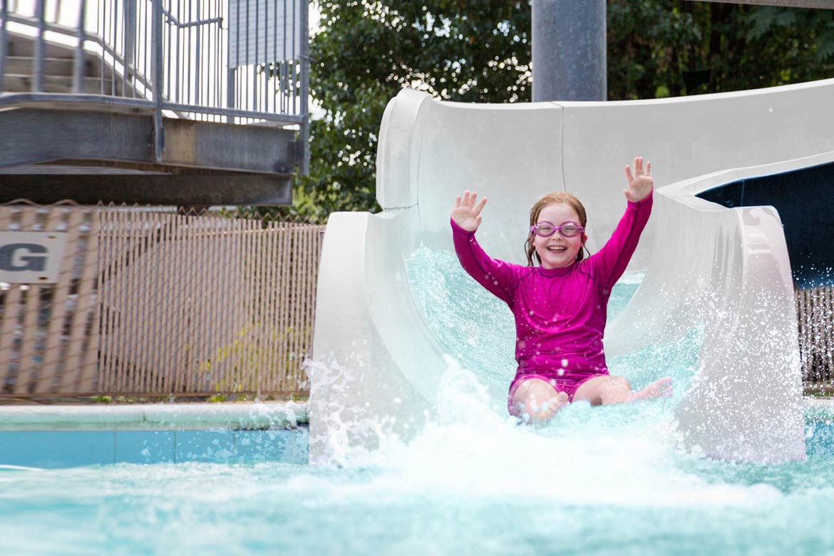 Girl going down slide at CWB